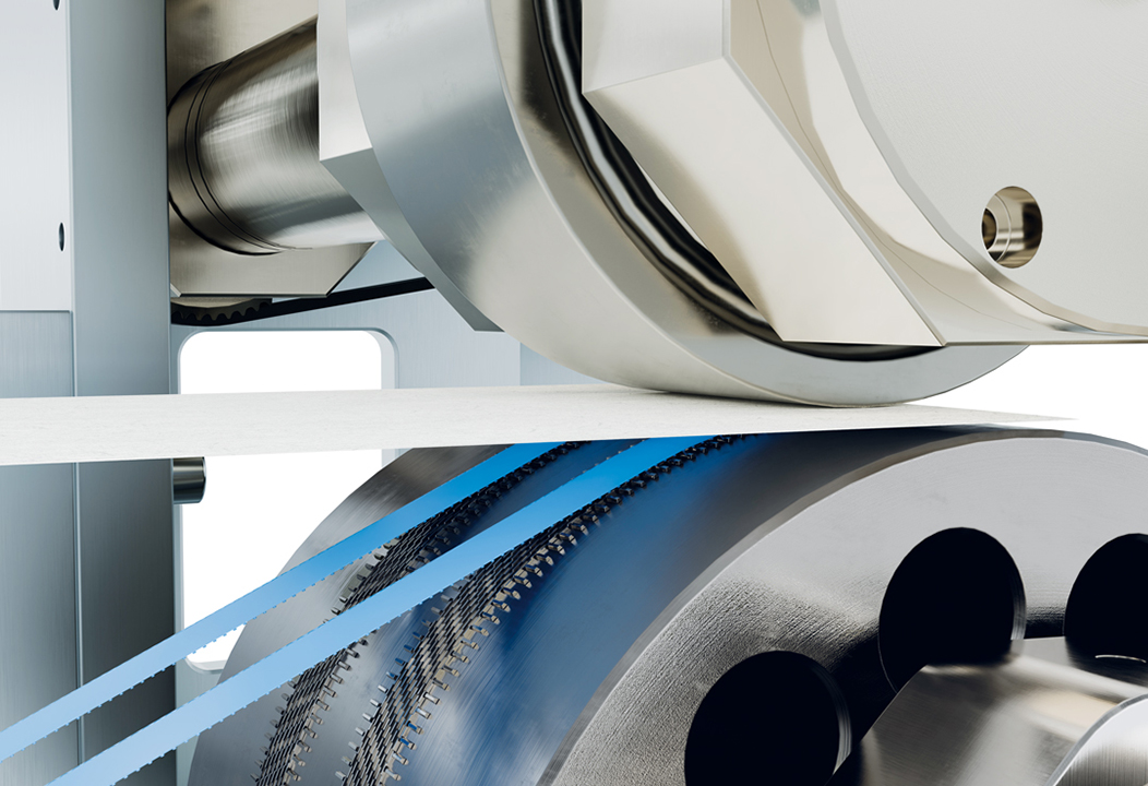 In-line welding unit by Binder and MS Ultrasonic attaching hook fasteners to tape to create adhesive-free diaper closure system.