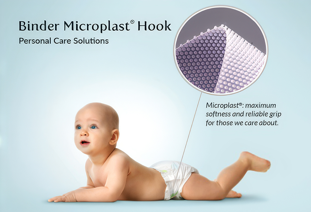 Vintage advertisement showing a baby wearing a diaper with a close-up of the hook closure system