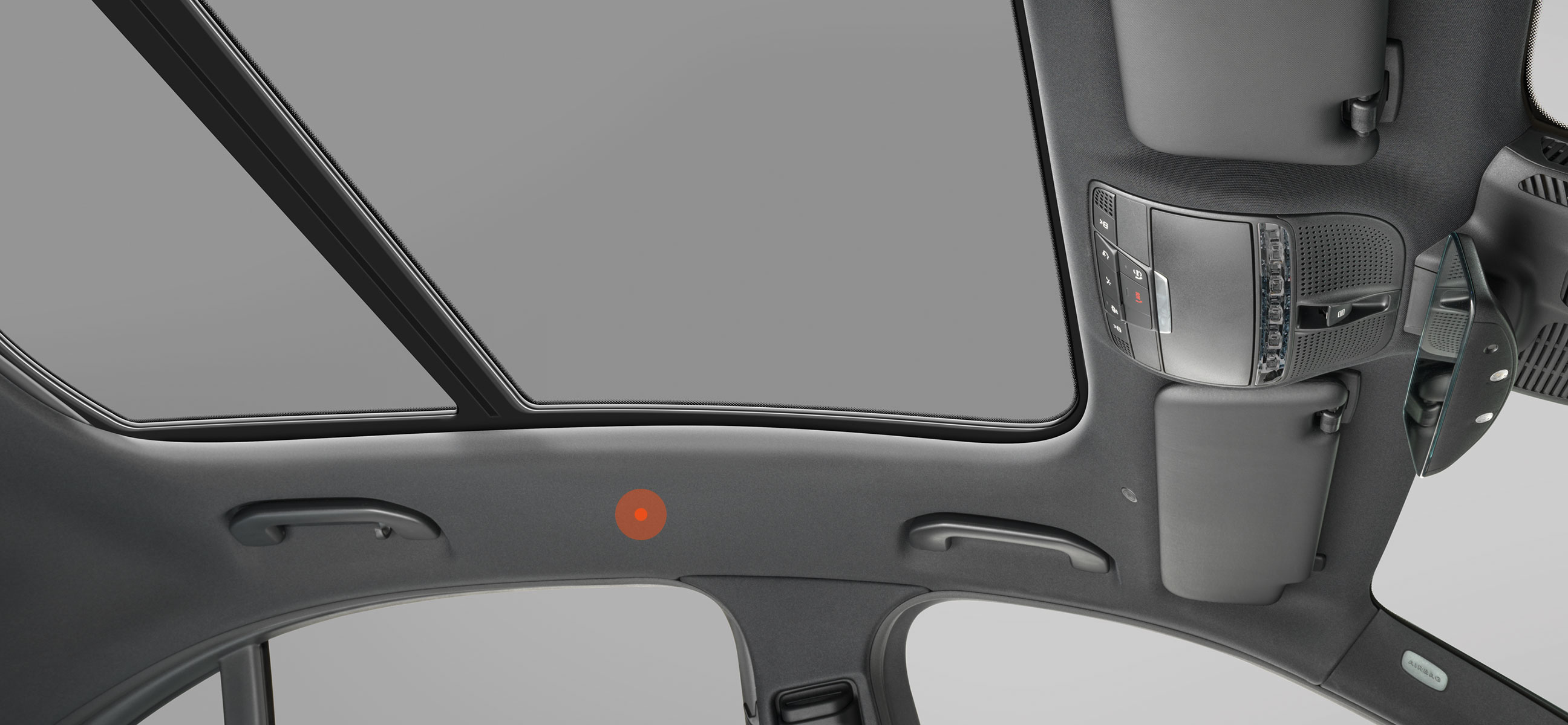 Interior view of an automotive vehicle showing the headliner